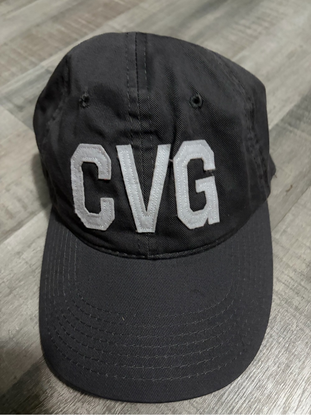 Black Baseball Cap with White CVG Embroidery - Cinch airport